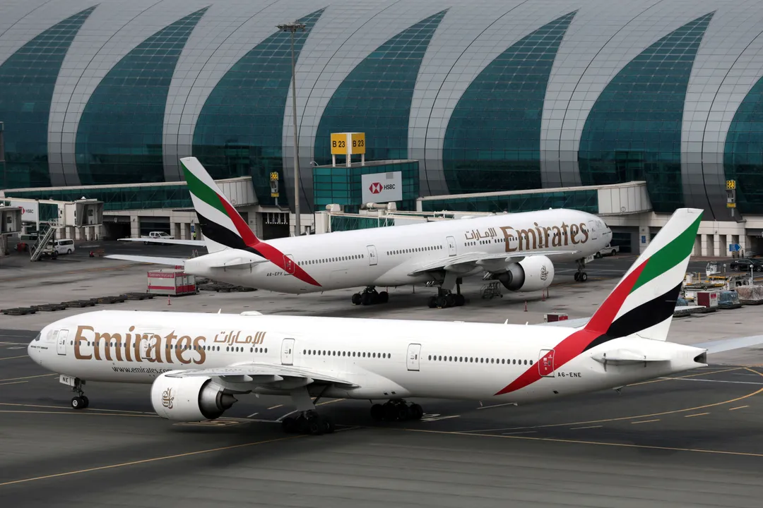 Emirates Airline Boeing 777-300ER planes are seen at Dubai International Airport Photograph:(Reuters) 