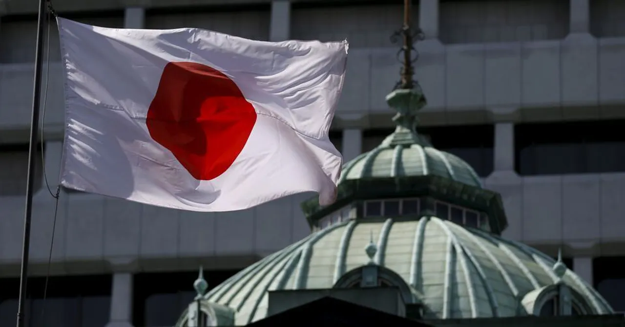  A Japanese flag flutters atop the Bank of Japan building in Tokyo. Photograph:(Reuters) 