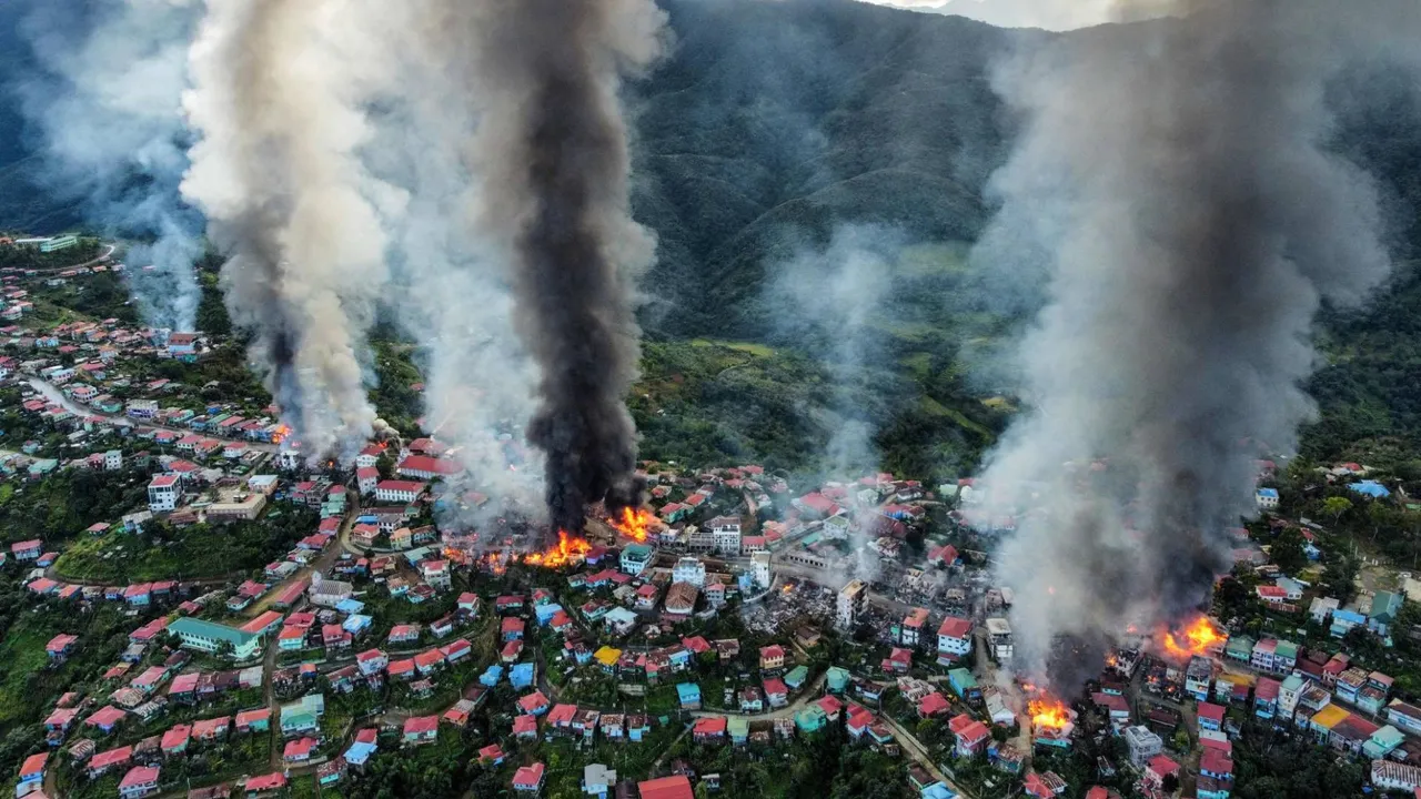  Smoke rises from fires in Thantlang in Chin State, where more than 160 buildings were destroyed in late October after shelling from junta military troops, according to local media. Photograph:(AFP) 
