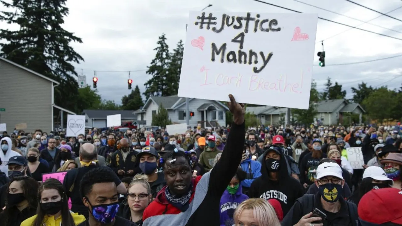  As per video footage of the incident — including bystander video — on March 3, 2020, the officers punched 33-year-old Manuel Ellis and put him in a chokehold from behind. They also shot him with a stun gun and knelt on his back, which cut off Ellis' air supply. Photograph:(AFP) 