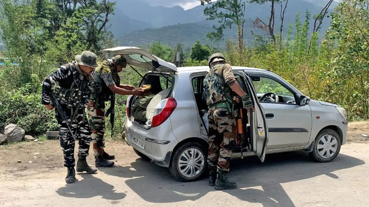  Army personnel and Assam Rifles check the vehicle on the national highway 37 in violence-hit Manipur Photograph:(ANI) 