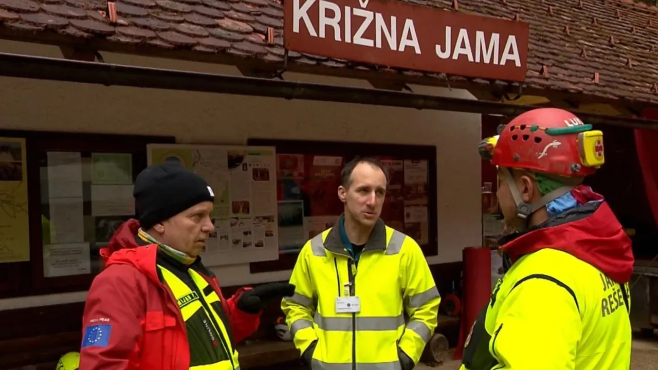  Rescuers gather outside the Krizna Jama cave near Grahovo, Slovenia. Photograph:(AP) 