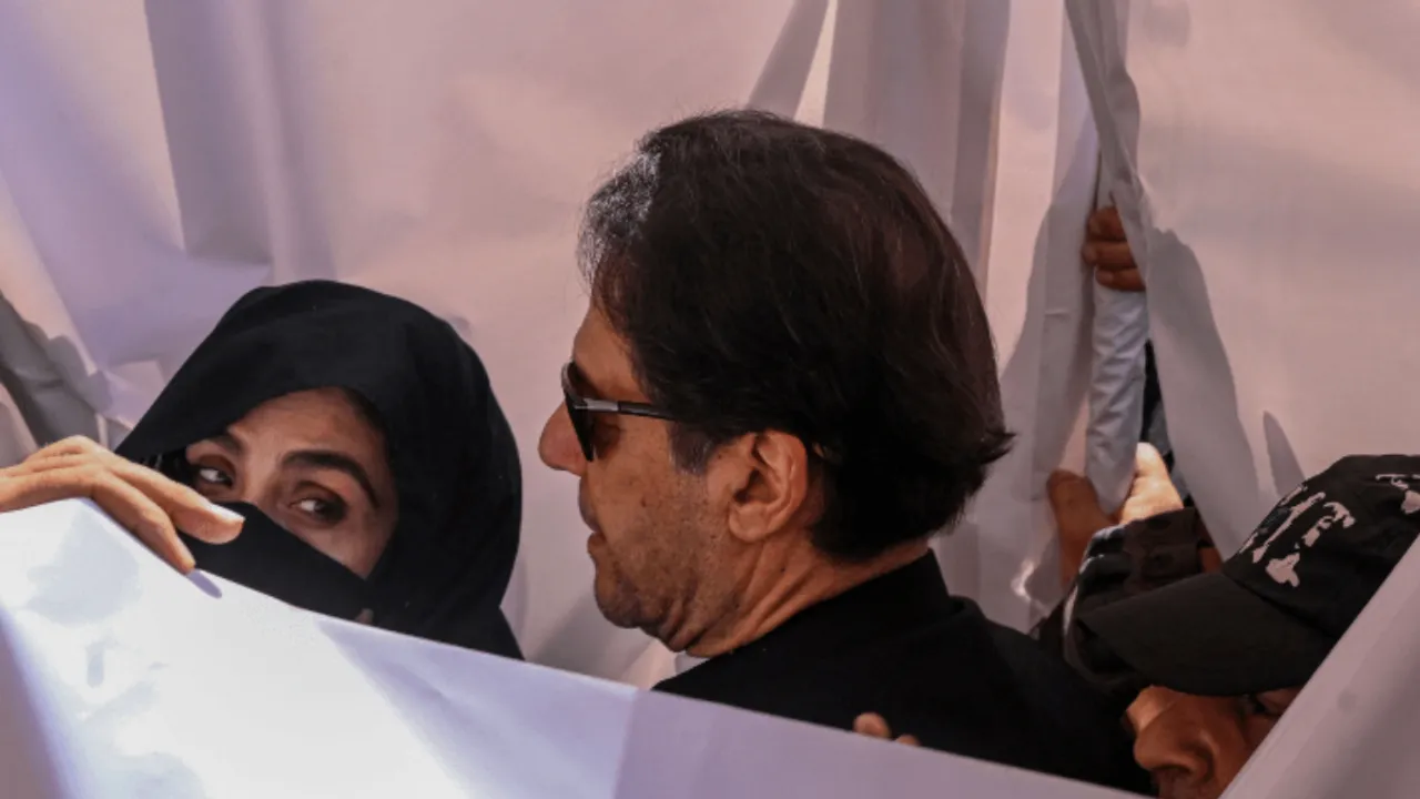  Pakistan's former prime minister Imran Khan and his wife Bushra Bibi. Photograph:(AFP) 