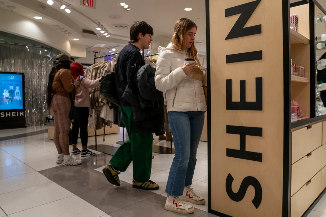  People shop at the Shein Holiday pop-up shop Photograph:(Reuters) 