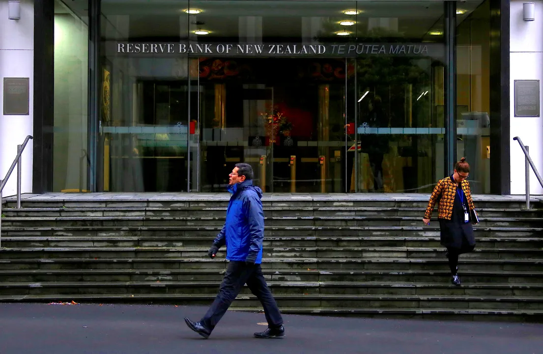 Pedestrians walk near the main entrance to the Reserve Bank of New Zealand located in central Wellington, New Zealand Photograph:(Reuters) 