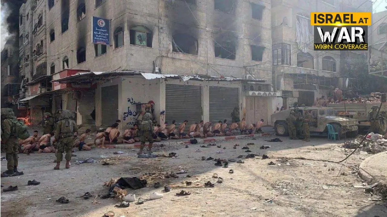 File photo: Captured and detained Palestinians sit on a street in Beit Lahia, northern Gaza Strip, as Israeli soldiers stand guard, amid the ongoing ground operation of the Israeli army against Palestinian Islamist group Hamas.  Photograph:(Reuters) 
