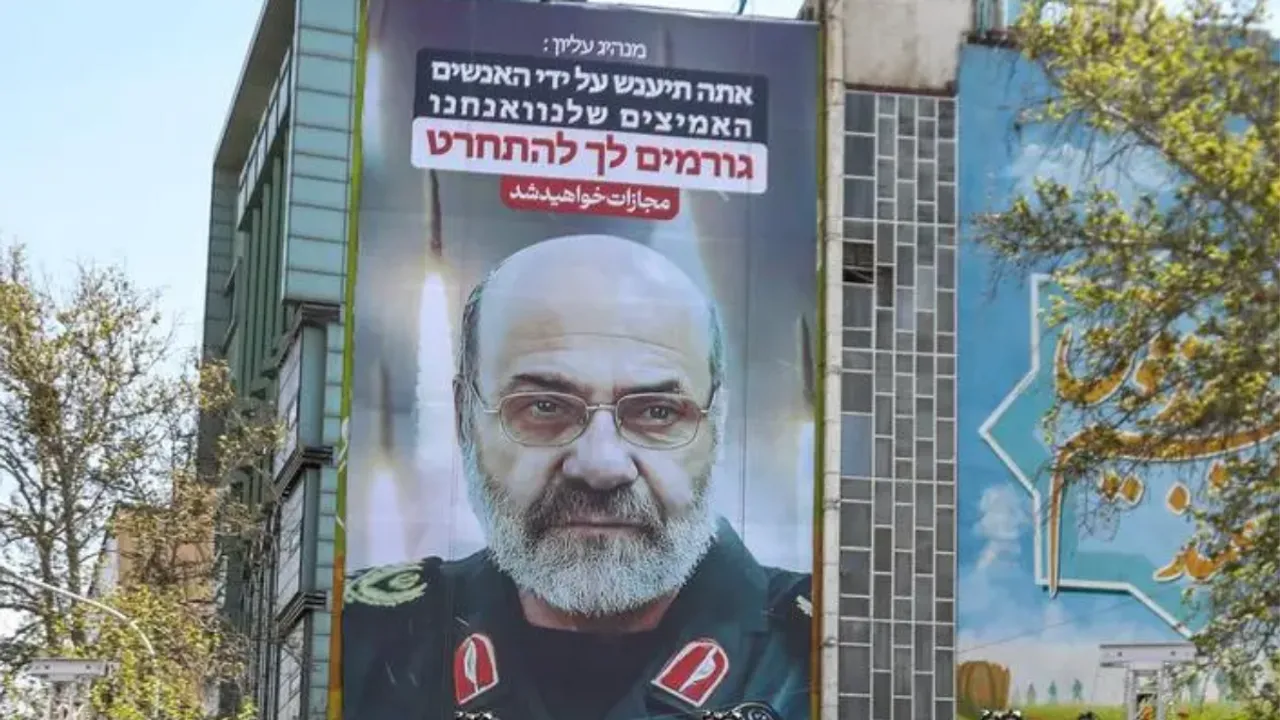  A billboard displays a portrait of slain Iran's Brigadier General Mohammad Reza Zahedi with a slogan in Hebrew saying, "You will be punished", on April 3, 2024 at Palestine Square in Tehran.(Photo by ATTA KENARE / AFP) Photograph:(AFP) 