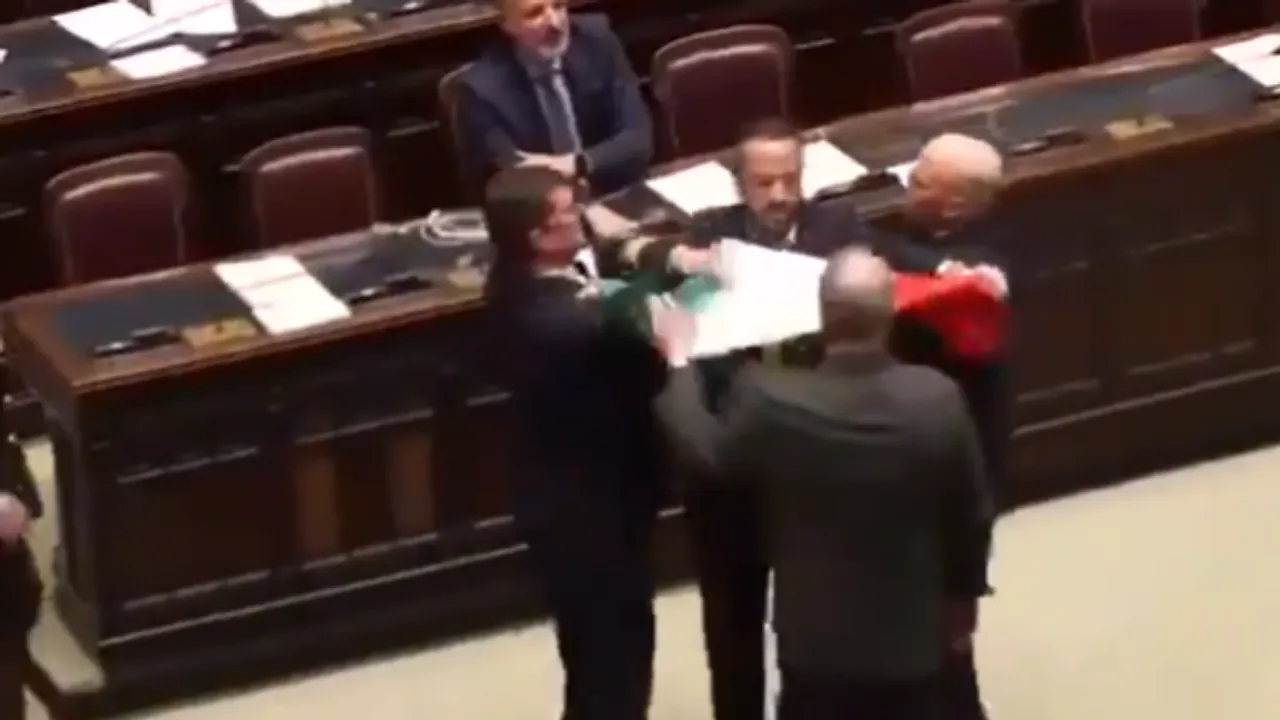  Screengrab of the viral video of Italian MPs fighting each other. Photograph:(Others) 