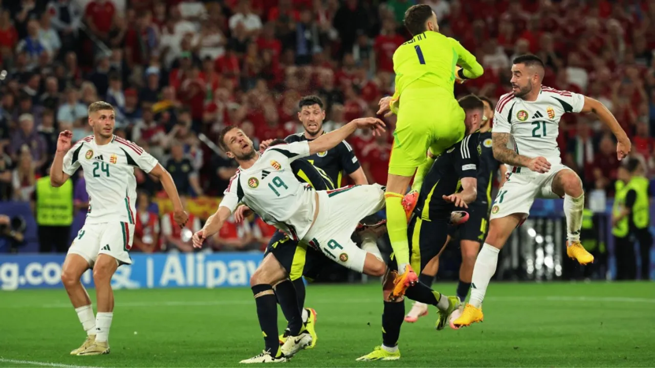  Barnabas Varga (#19) falling on the pitch during Euro 2024 game vs Scotland. Photograph:(AFP) 