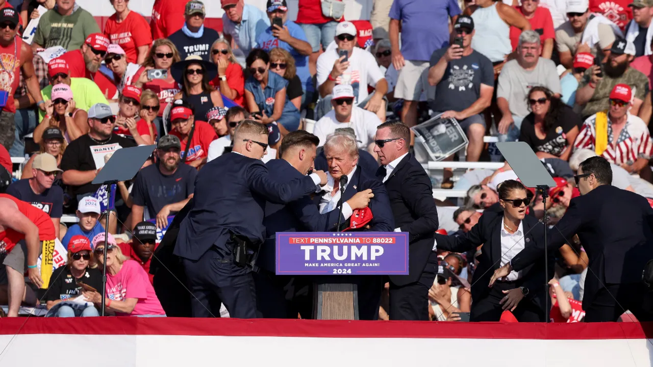  Republican presidential candidate and former U.S. President Donald Trump is assisted by U.S. Secret Service Photograph:(Reuters) 