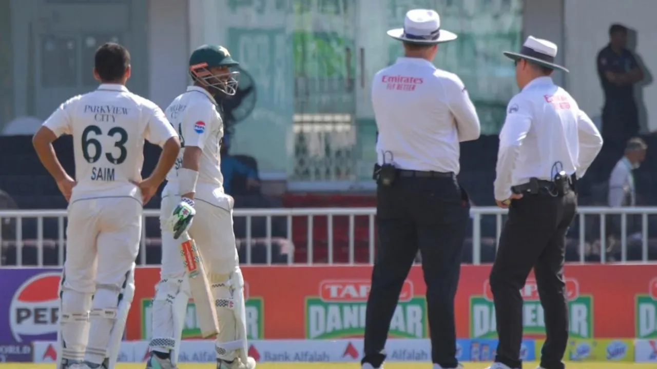  Pak skipper Shan Masood (with bat in hand) not happy with decision (Source: PCB) Photograph:(Others) 