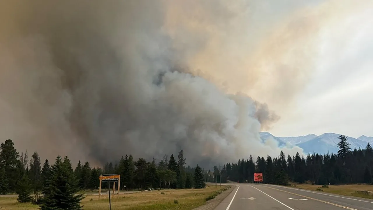  In this July 24, 2024, image obtained from the Jasper National Park in Canada, smoke rises from a wildfire burning in the park.  Photograph:(AFP) 