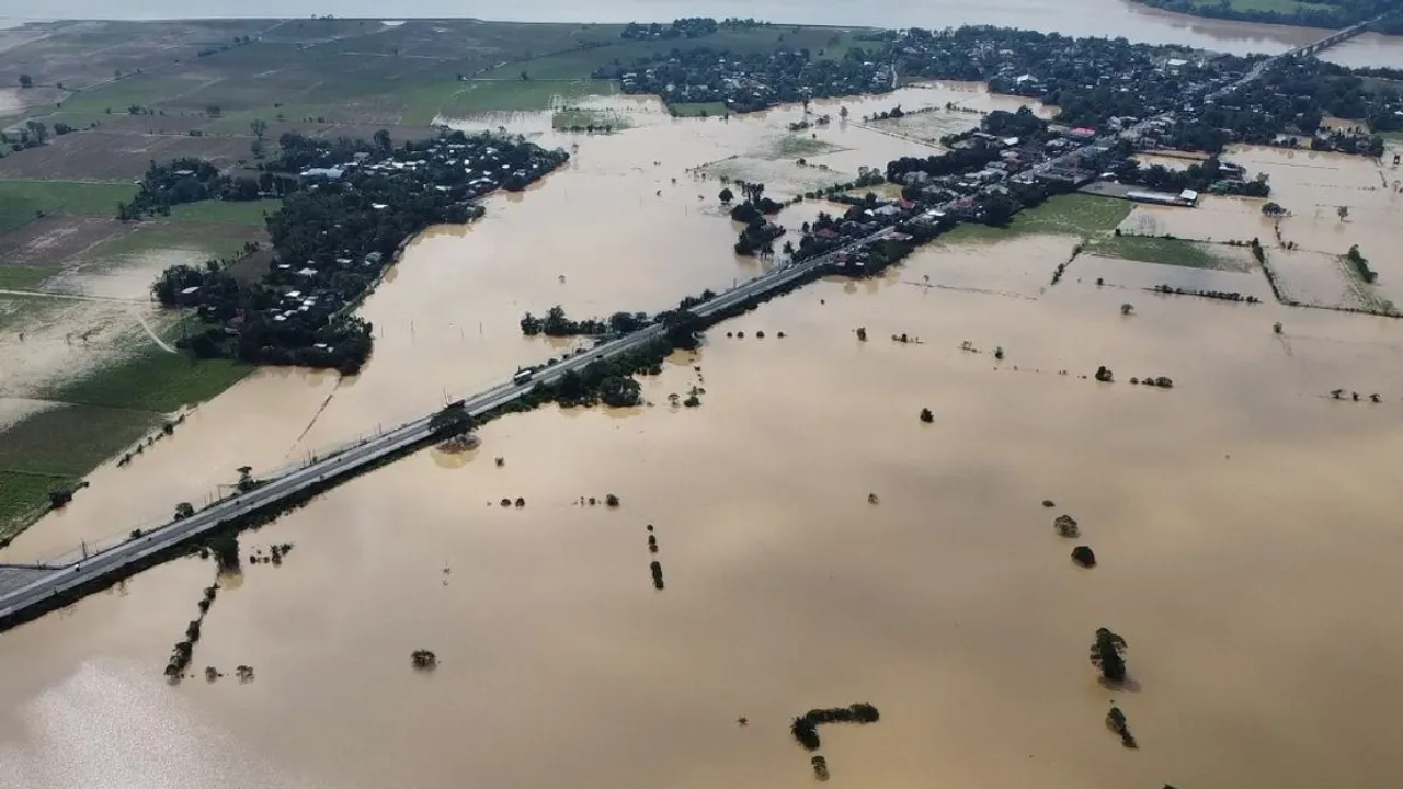  An aerial photo shows a swollen river inundating farm fields and houses at a village in Ilagan town, Isabela province on November 12, 2024, a day after Typhoon Toraji hit the province. The Philippines issued fresh weather warnings on November 12 as the fifth major storm in three weeks bore down on the archipelago, days after thousands were evacuated ahead of Typhoon Toraji. Photograph:(AFP) 