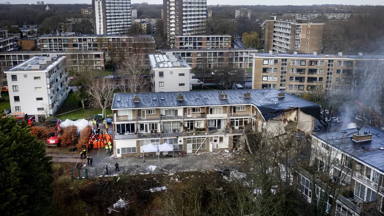  Emergency services stand at the site of a partially collapsed residential building following a fire and an explosion in The Hague  Photograph:(AFP) 