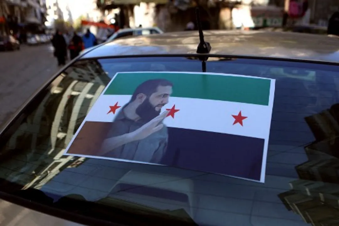  The portrait of Islamist group Hayat Tahrir al-Sham (HTS) leader Abu Mohammed al-Jolani is pictured on the back of a car in the coastal Syrian city of Latakia, on December 10, 2024. Photograph:(AFP) 