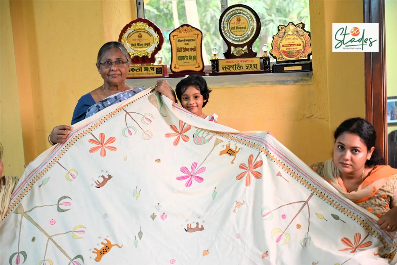 Pritkana Goswami, her younger daughter Ankita Roy and her granddaughter displaying a Nakshi Kantha work. 