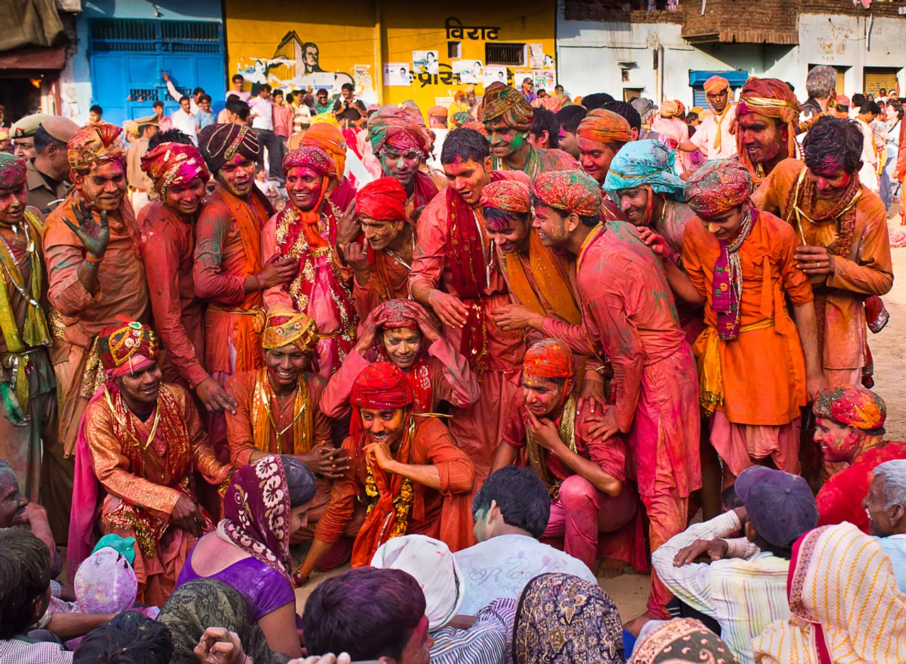 From beating men with sticks to throwing laddus, the colours of Holi in Braj