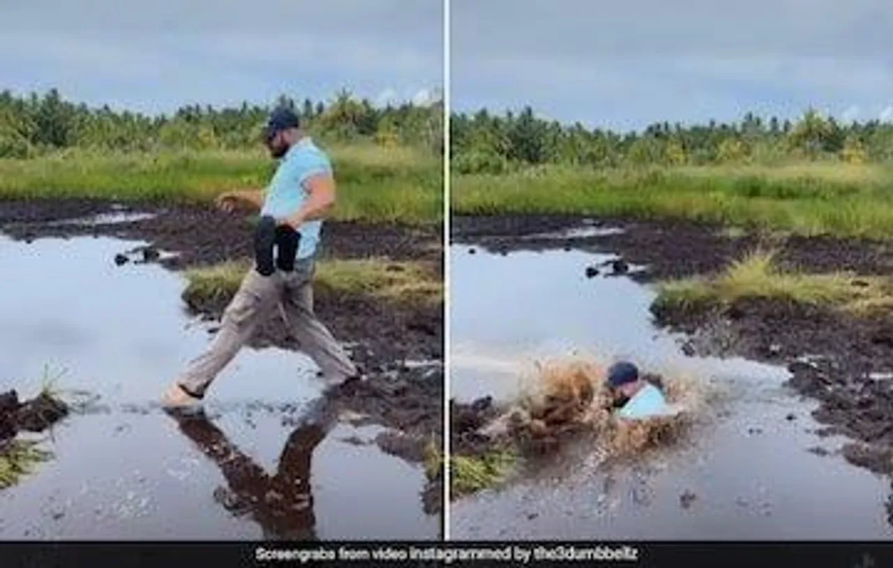 Husband Plunges Down Muddy Water As Wife Laughs Hysterically