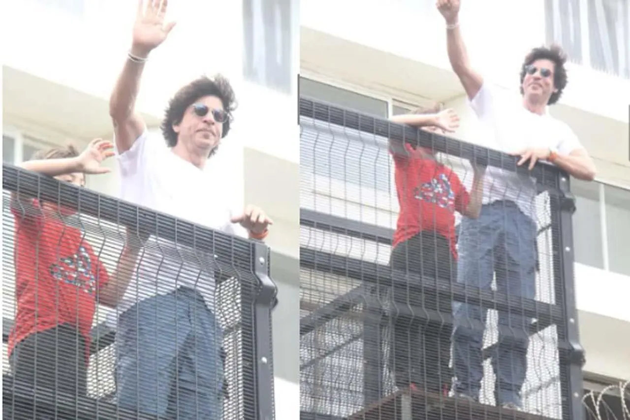 Shahrukh Khan with son Abram Khan greets his fans