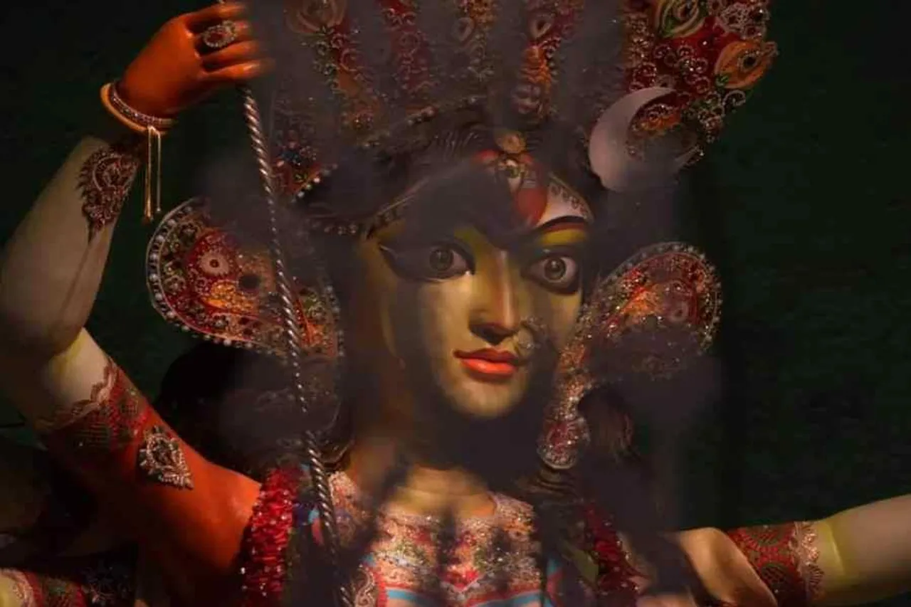 The idol of Maa is making by a woman, Kashi Bose Lane Durga Puja Samity