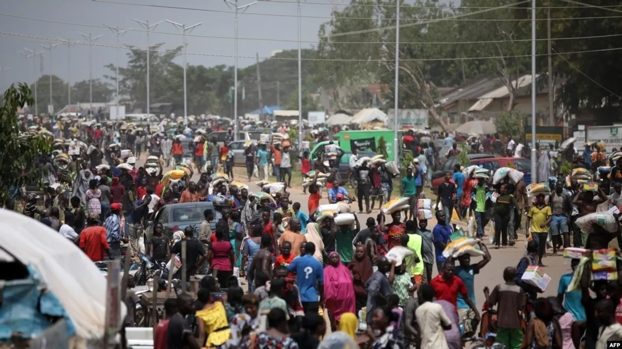 FCT Residents Loot NEMA Warehouse Amid Nigeria's Economic Crisis