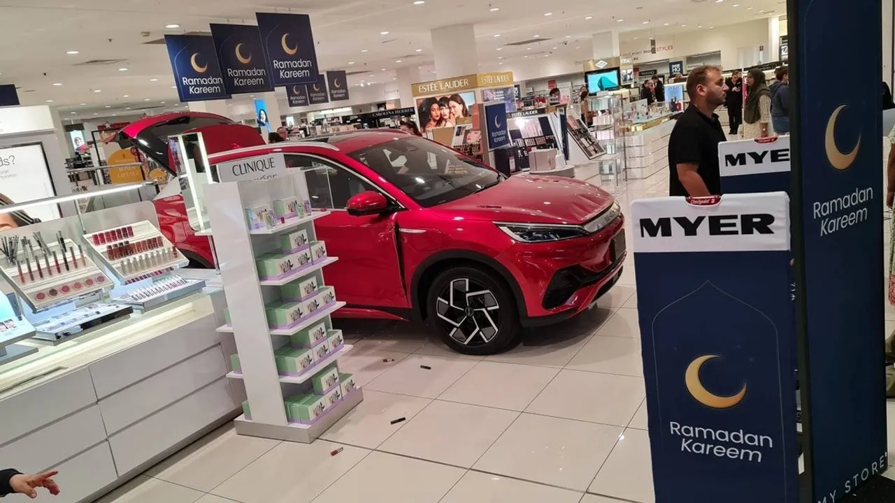 Electric Car Display Chaos Vehicle Crashes into Myer Storefront in