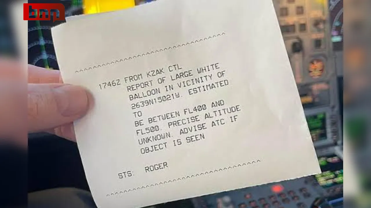 A large white balloon is seen floating over Honolulu, Hawaii