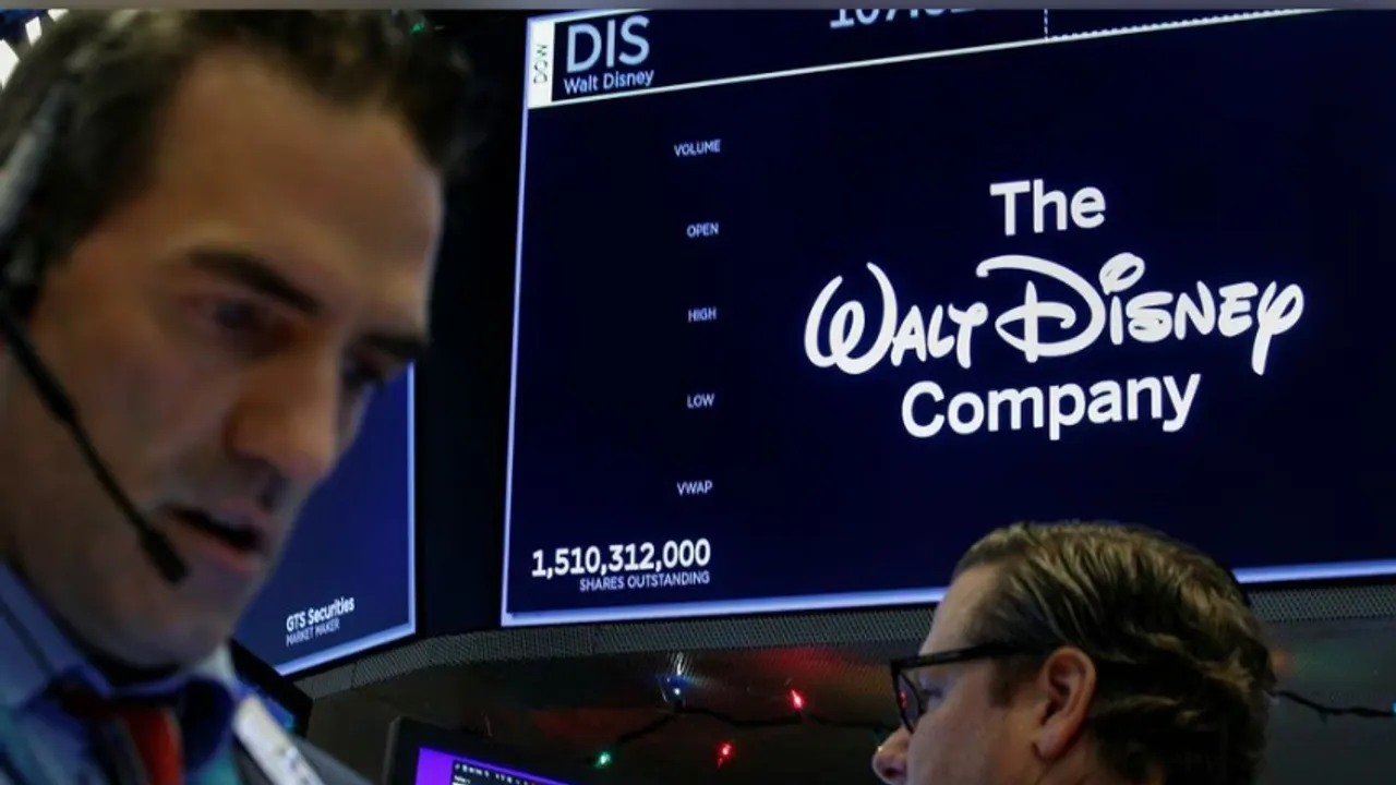 Traders work at the post where Walt Disney Co. stock is traded on the floor of the New York Stock Exchange (NYSE)
<br>
Image Credit: Reuters
