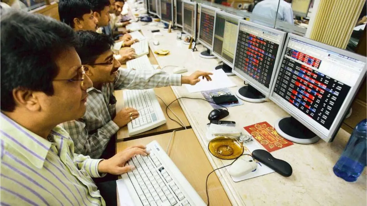 Stock brokers at their terminals in a stock exchange