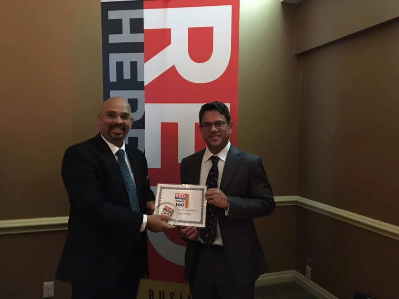 Snehashish Bhattacharjee Global CEO Co Founder Denave recieving the Red Herring Top Global Award