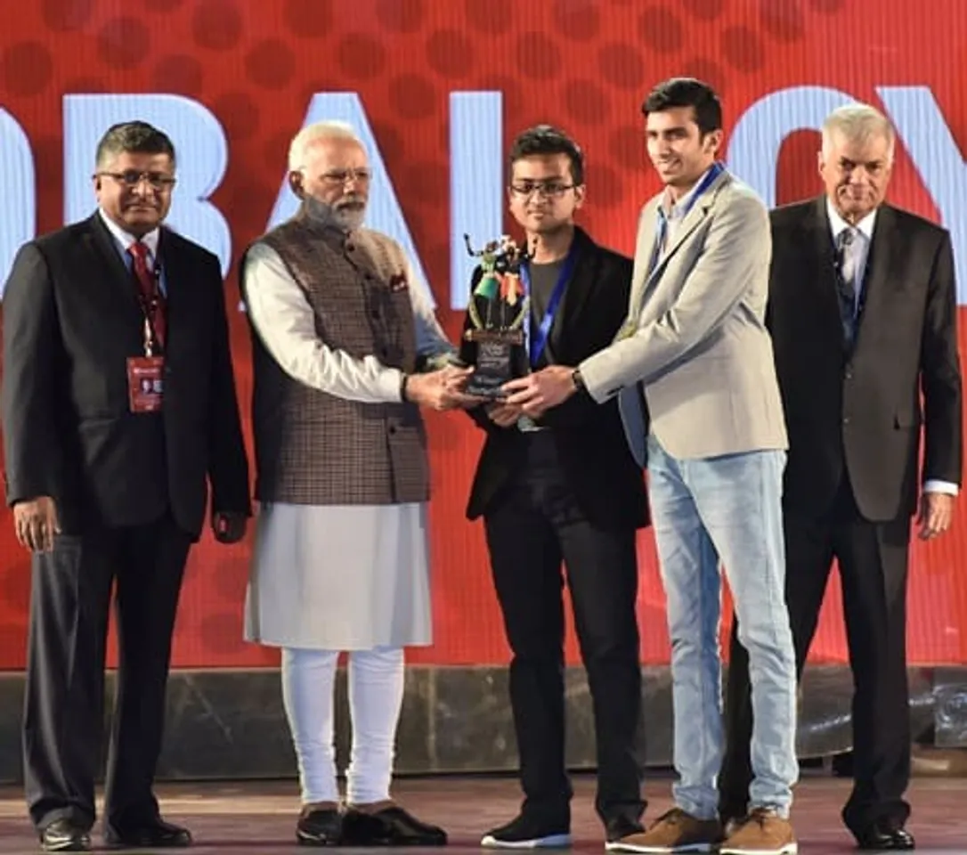 PM Modi felicitates Shikhil Sharma and Ananda Krishna from NIIT University NU at the Global Conference on Cyberspace GCCS