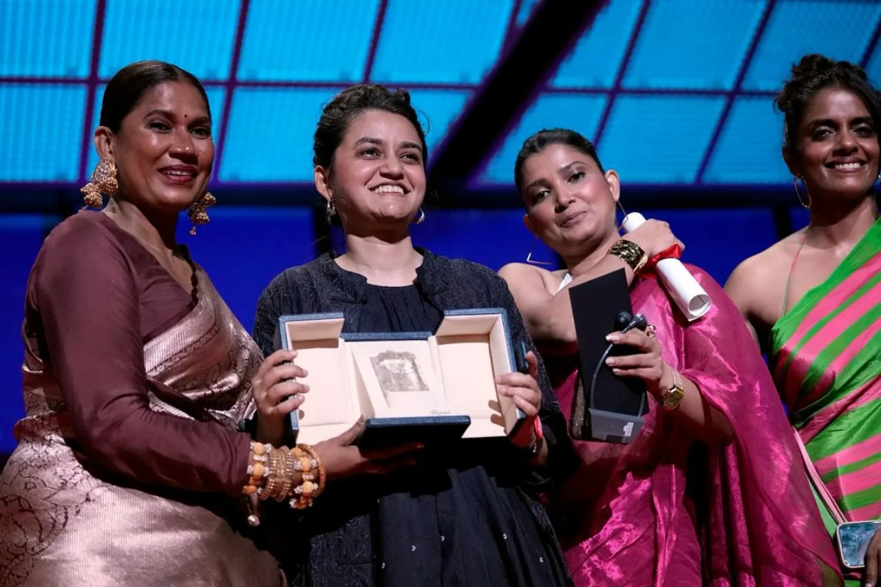 Payal Kapadia on stage winning the award