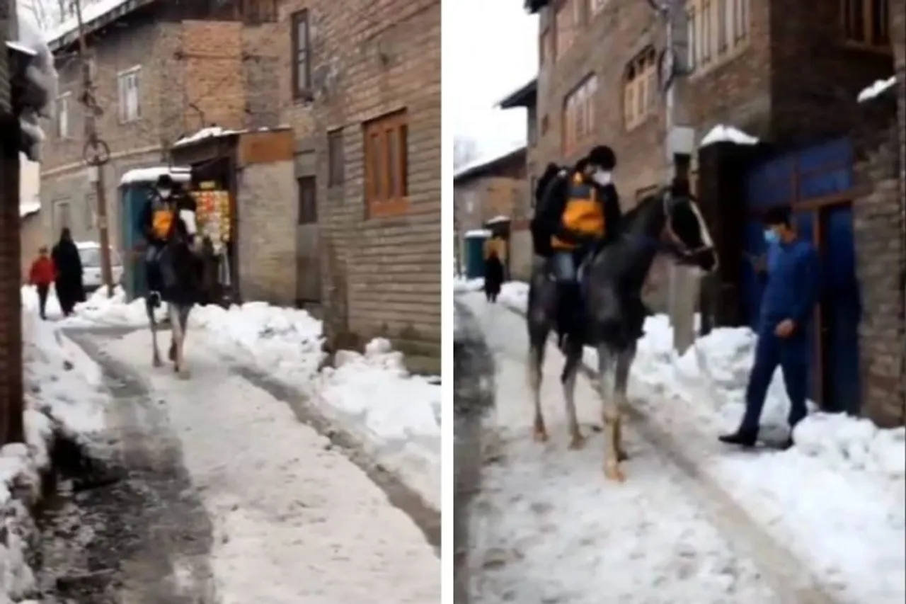 Delivery person rides horse in snow-covered Kashmir to drop off order