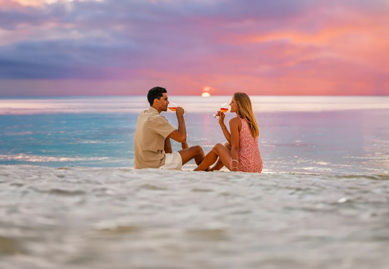 OZEN LIFE MAADHOO Lifestyle Couple on Beach Sunset Champagne 3 exp-01 2029 edit1