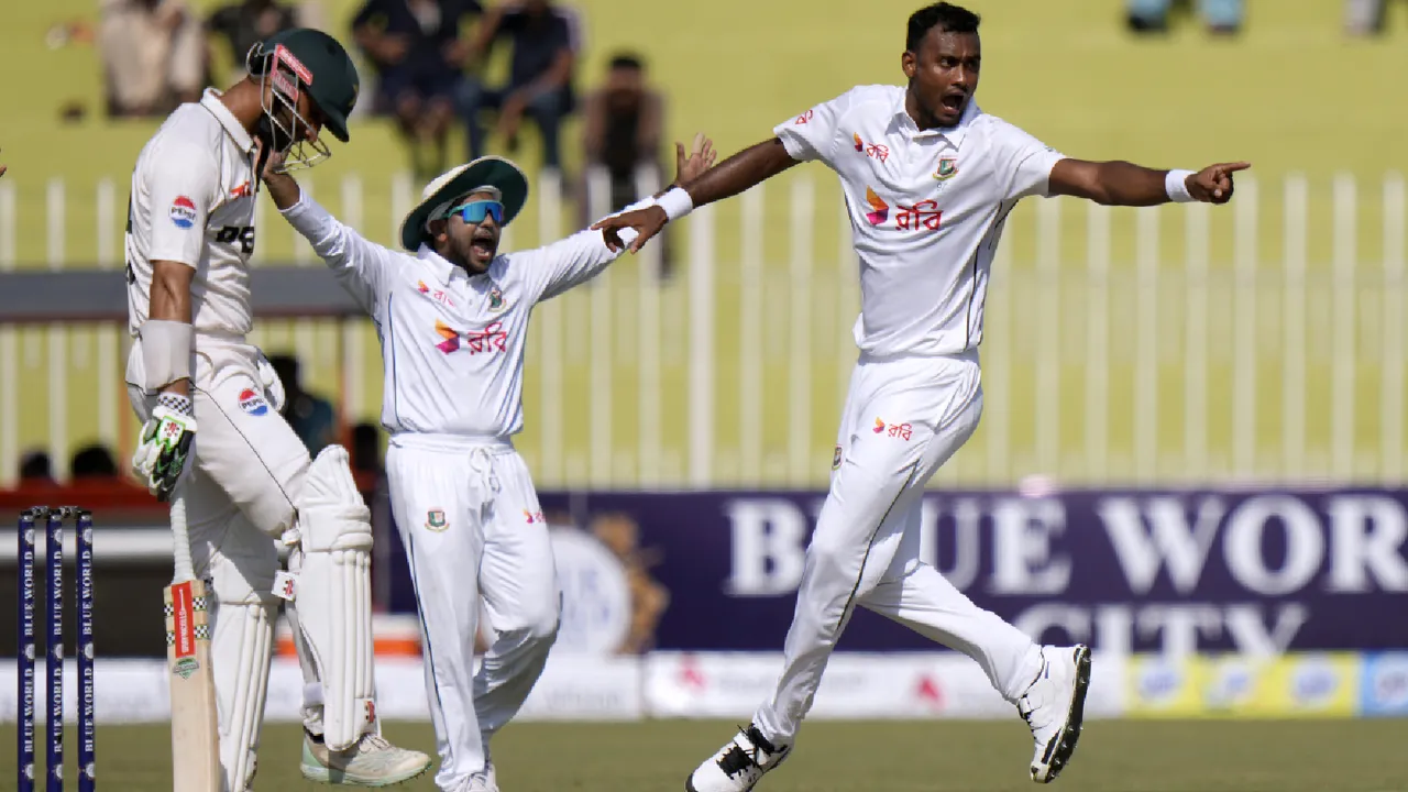 Bangladesh's Shoriful Islam, right, and teammate appeals successful dismissal of Pakistan's Shan Masood, center, during the first day of first cricket test match between Pakistan and Bangladesh, in Rawalpindi, Pakistan