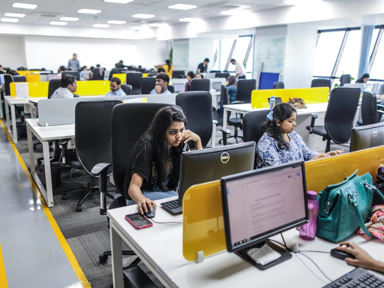 women employee working in office in india
