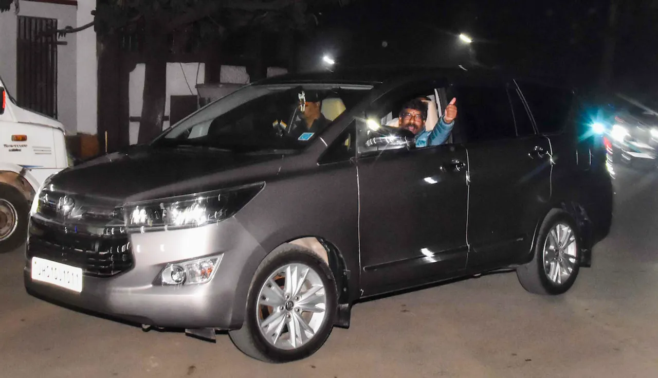 Hemant Soren gestures as he leaves from his residence for Raj Bhavan with ED officials, in Ranchi, Wednesday, Jan. 31, 2024