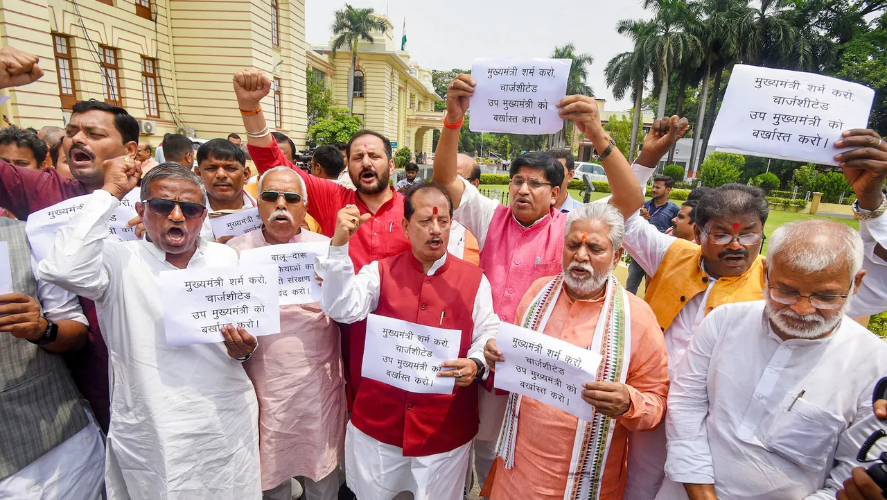 Leader of Opposition in Bihar Assembly Vijay Kumar Sinha with party legislators stages a protest demanding the dismissal of Bihar Deputy CM Tejashwi Yadav over his alleged involvement in the land for jobs scam case during Monsoon Session of the Assembly in Patna on July 11