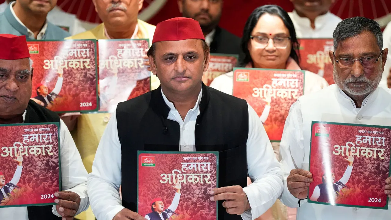 Samajwadi Party President Akhilesh Yadav releases party's manifesto for Lok Sabha elections, at party headquarters in Lucknow, Wednesday, April 10, 2024