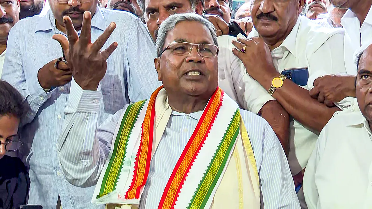 Congress leader Siddaramaiah reacts during a press conference as the party leads in Assembly polls on the vote counting day, in Mysuru