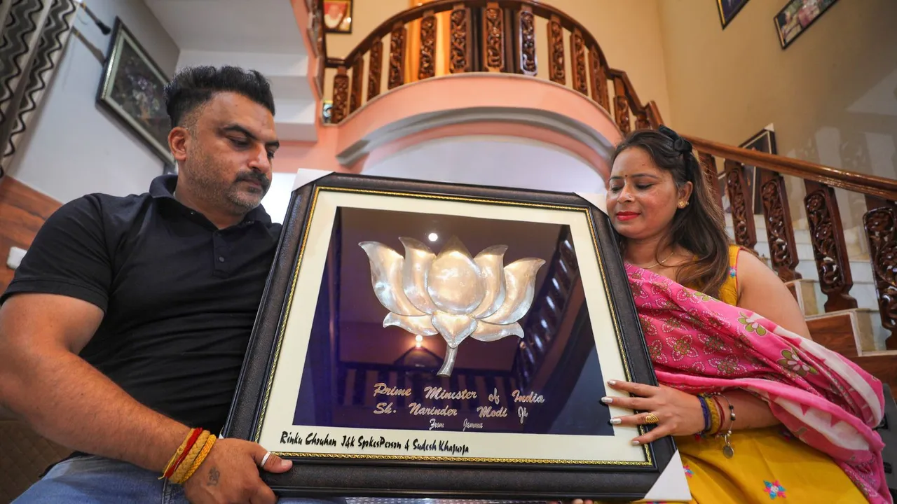 Rinku Chauhan, a jeweler from Jammu, shows his hand-made lotus flower, made of pure silver, which he wants to present to Prime Minister-designate Narendra Modi, on Sunday, June 9, 2024.
