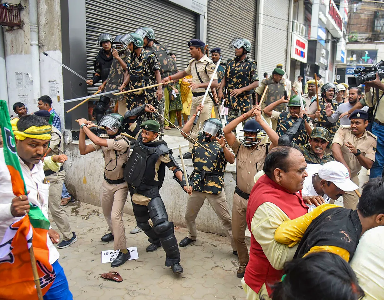 Security personnel baton charge BJP supporters during their protest march towards Vidhan Sabha in support of demands of teachers' job aspirants, in Patna