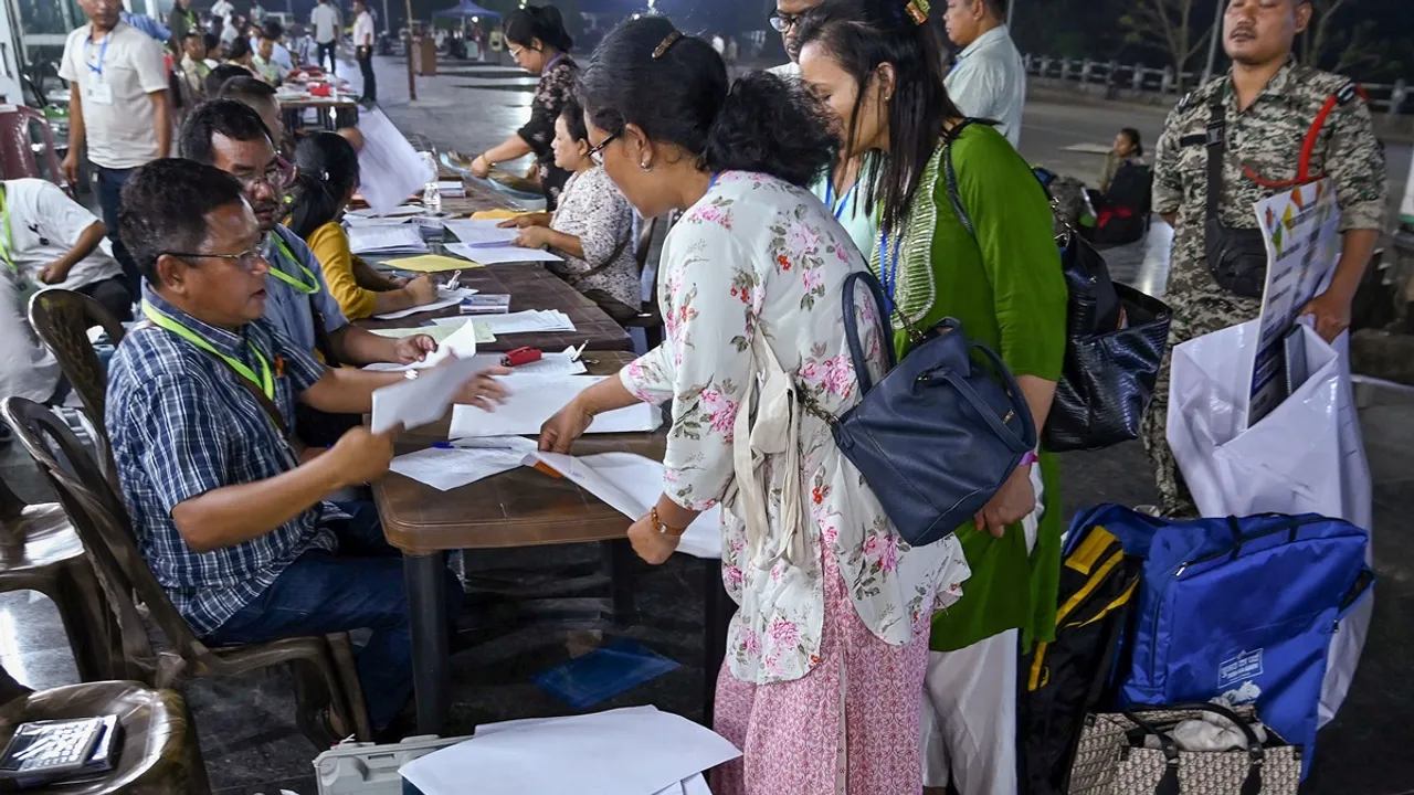 Polling officials from different polling stations return to the strong room to deposit the EVMs after voting for the first phase of Lok Sabha elections, in Tura, Meghalaya, Friday, April 19, 2024. 