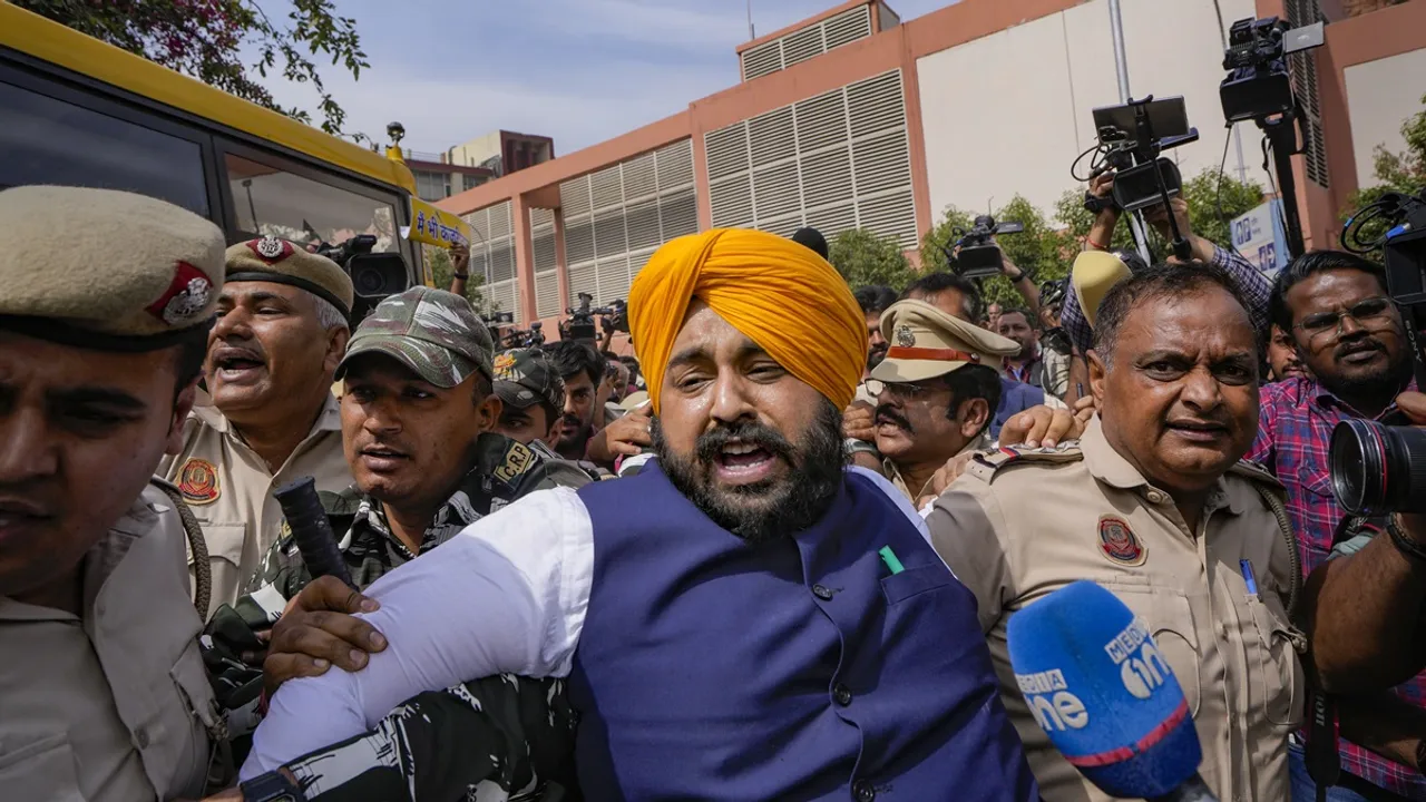 Security personnel detain Punjab Minster and AAP leader Harjot Singh Bains during their protest outside Patel Chowk metro station against the arrest of Delhi CM Arvind Kejriwal, in New Delhi, Tuesday, March 26, 2024
