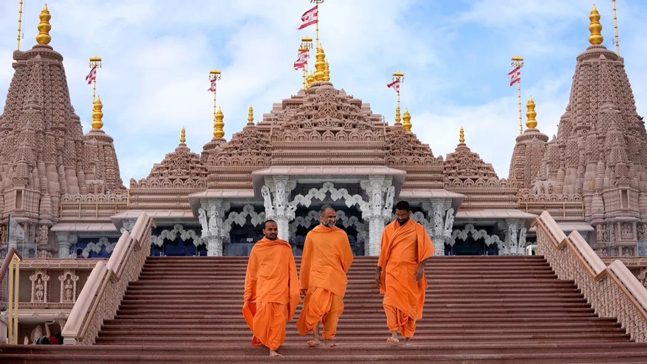 Hindu monks walk down the stairs of the first stone-built Hindu temple in Abu Dhabi, United Arab Emirates, on February 12, 2024