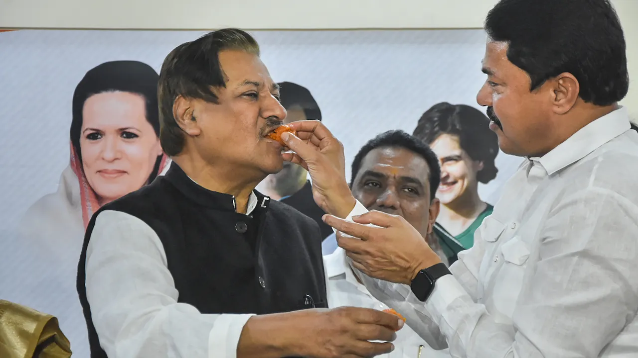 Maharashtra Congress President Nana Patole offers sweets to party leader Prithviraj Chavan after MVA's candidate Sudhakar Adbale won from Nagpur teachers' seat in the Maharashtra Legislative Council elections