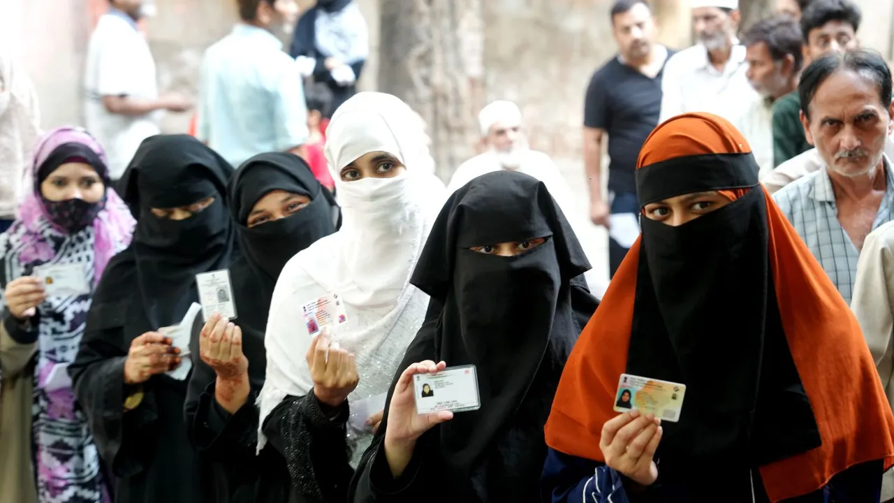 People wait in queues to cast their votes at a polling station during the fourth phase of Lok Sabha elections, in Kanpur, Monday, May 13, 2024