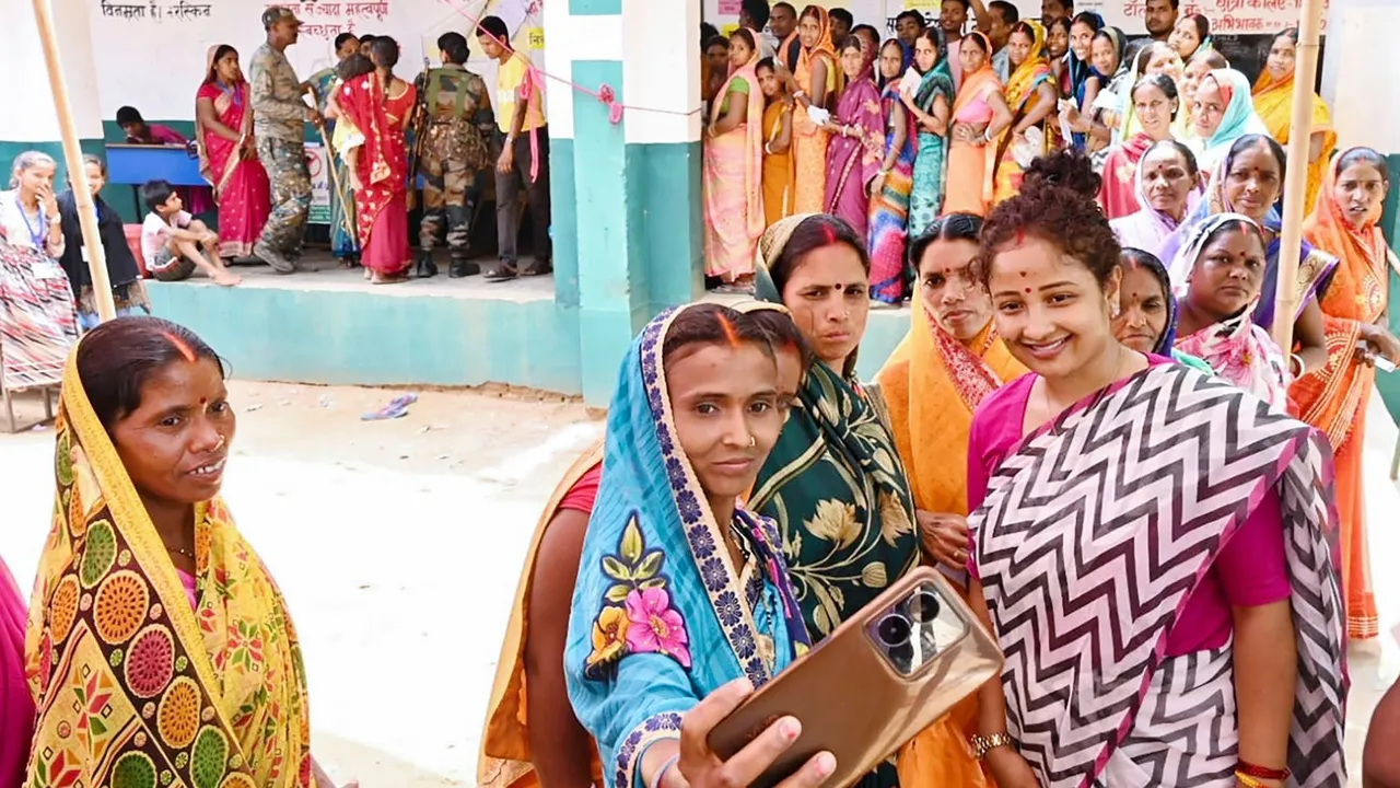 Jharkhand Mukti Morcha (JMM) candidate Kalpana Soren interacts with voters at a polling booth during the Gandey assembly seat by-polls, in Giridih district, Monday, May 20, 2024