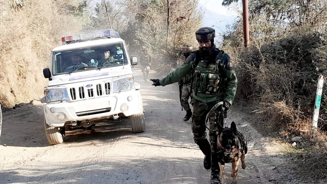 Security personnel during a cordon and search operation near the site where Army vehicles were ambushed by terrorists on Thursday, in Poonch district, Friday, Dec. 22, 2023.