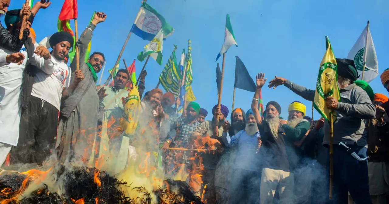 Farmers burn effigies during the 'Black Day' protest at the Punjab-Haryana Shambhu border, in Patiala district, Friday, Feb. 23, 2024. Farmers are observing 'Black Day' following the death of a farmer at Khanauri border in Sangrur district
